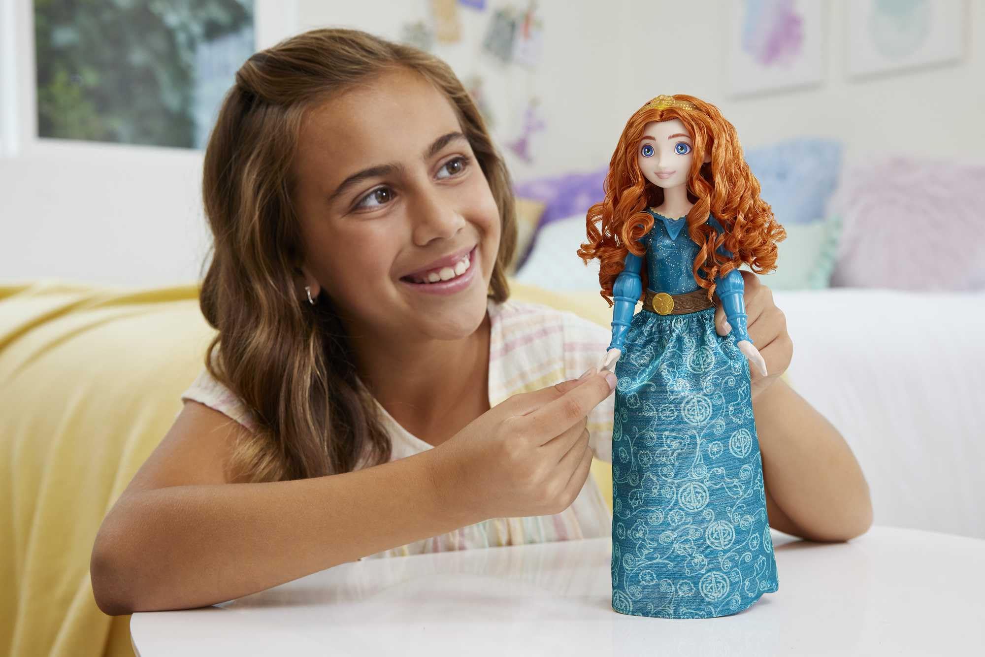 Merida doll with removable skirt showcased for interactive dress-up play.