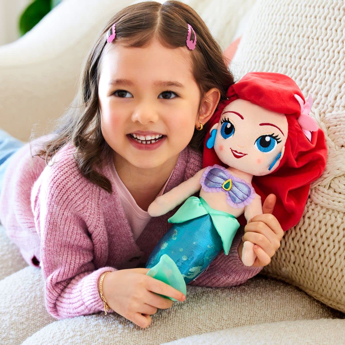 Disney Store Ariel plush shows embroidered features for durable, endearing detail.