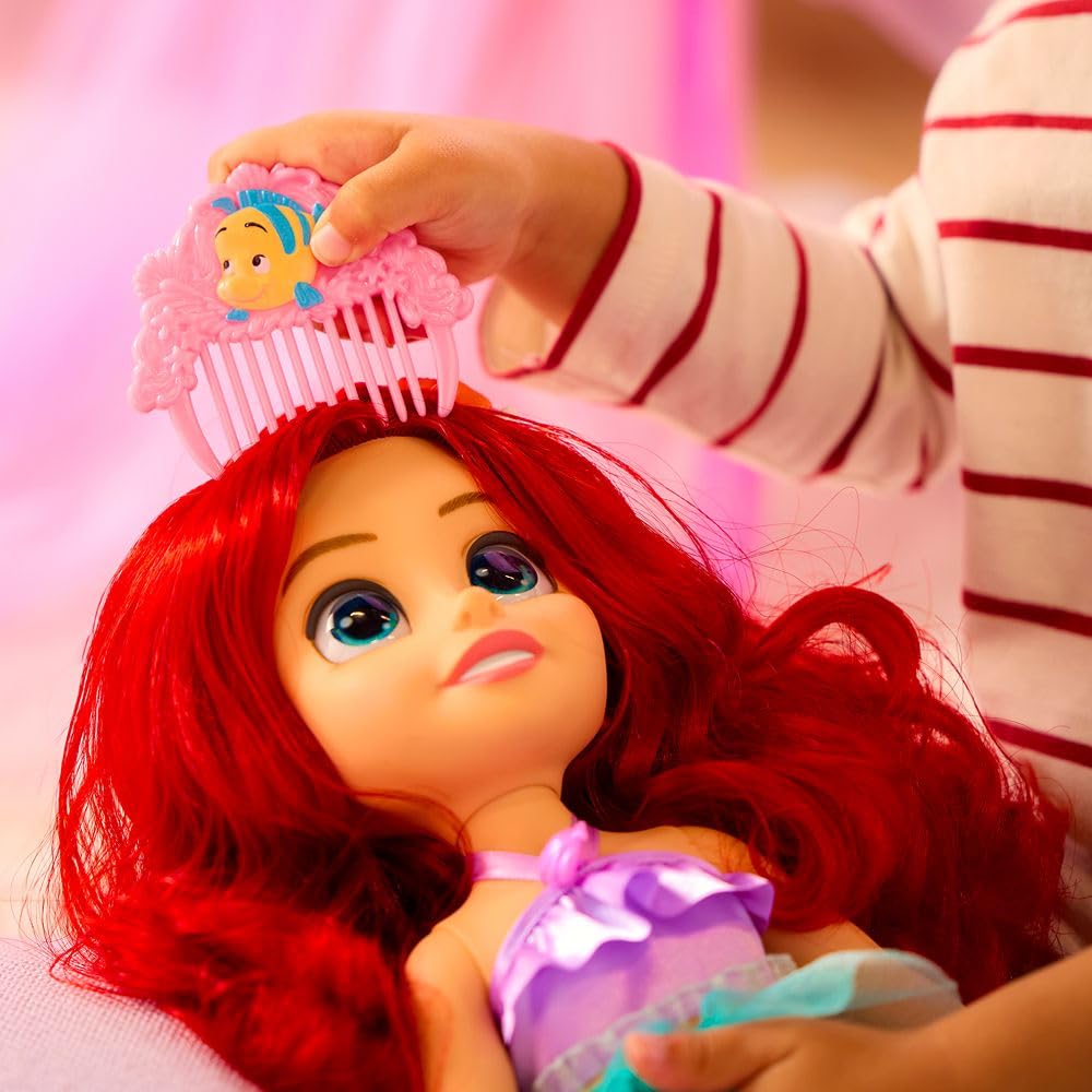 Printed scales and foil accents enhance the mermaid-inspired costume's shimmer.