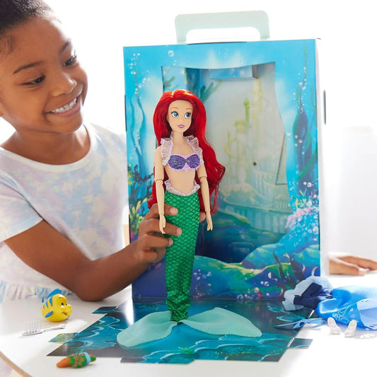 Ariel Story Doll wearing an extra satin dress for versatile styling