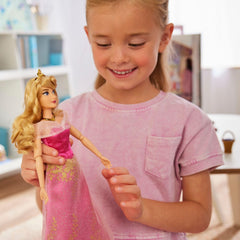Owl figure accompanies Aurora doll for friendship adventures
