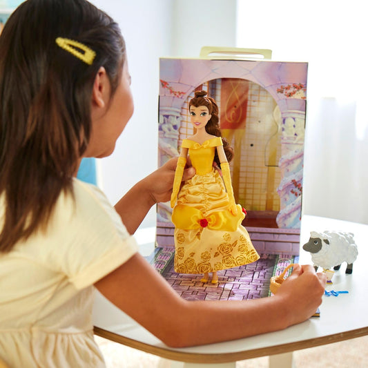 Belle wearing blue satin dress with pink apron for versatile play scenarios.