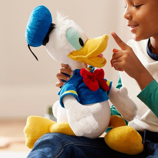 Disney Store Donald Duck plush in sailor suit with bow tie for adventures.