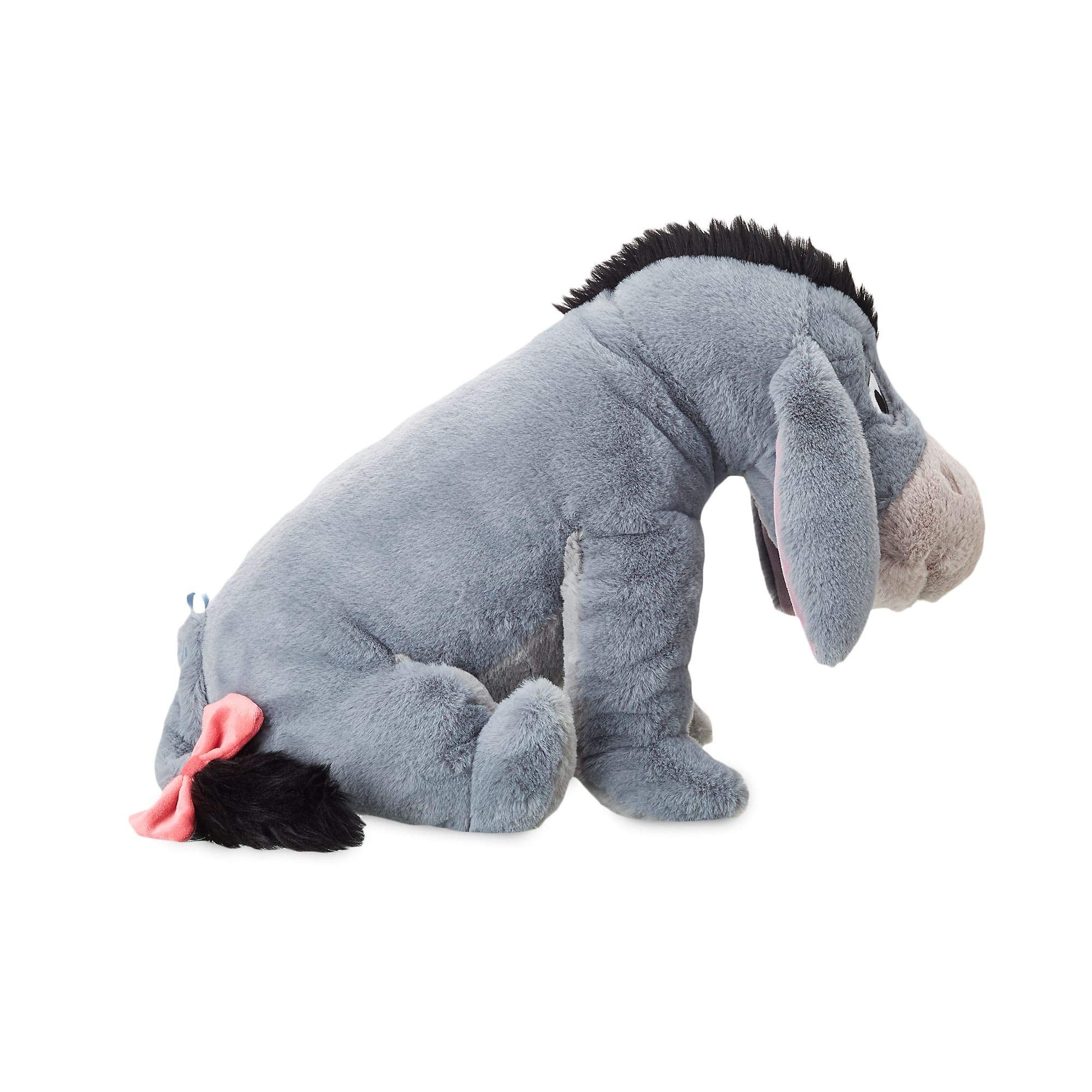 Disney Store Eeyore plush featuring bead-filled body offers cushioned support during snuggle sessions.