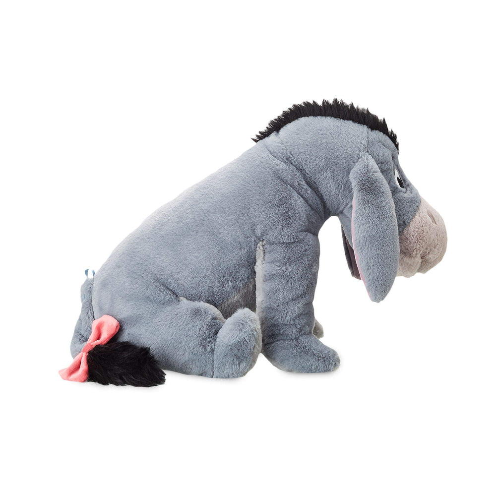 Disney Store Eeyore plush featuring bead-filled body offers cushioned support during snuggle sessions.