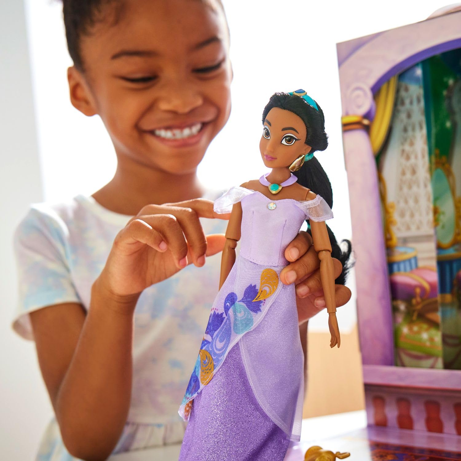 Disney Store Jasmine Story Doll includes lavender satin dress for alternate looks.