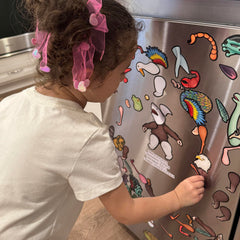 Fridge magnets on a metal surface from Dissent Pins for easy rearrangement and storytelling.
