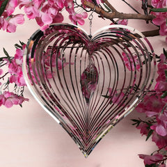 Close-up of DJUAN wind spinner heart design with glittering detail and breeze spins.