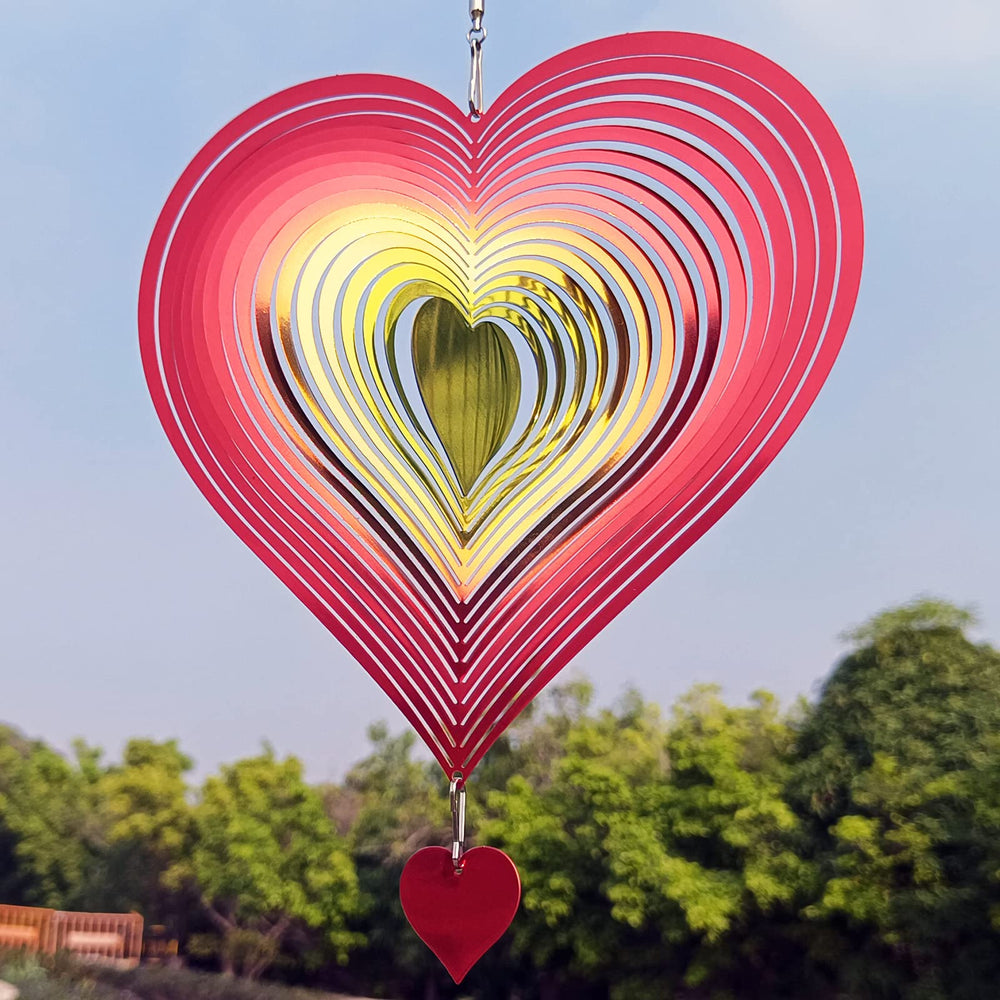 DJUAN stainless steel wind spinner gleams in sun, adds reflective art to yards and patios
