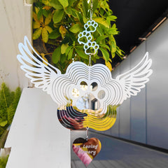 DJUAN window display wind spinner offers a gentle tribute.