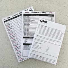 DNB Canasta 50-sheet score pad for easy round-by-round scoring.