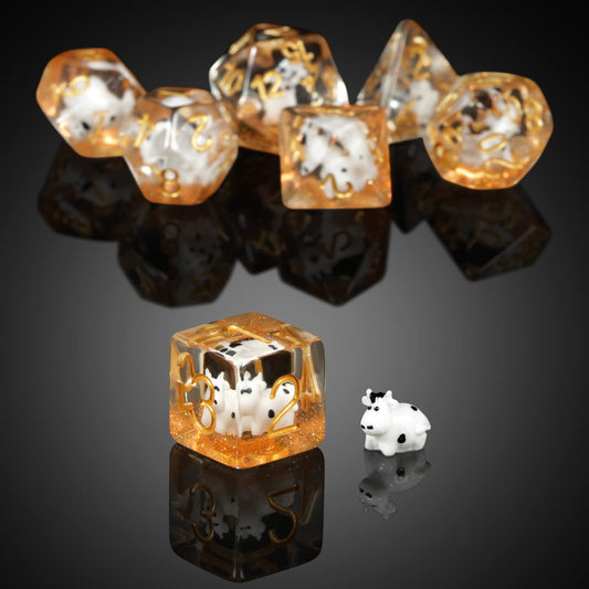 DNDND cow d4 die with easy-to-read gold numerals on clear resin.