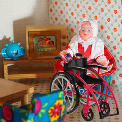 DOITOOL red mini wheelchair prop for playful storytelling in mini scenes.