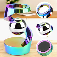 DOLASEV kinetic desk toy closeup rainbow finish highlights premium aluminum.