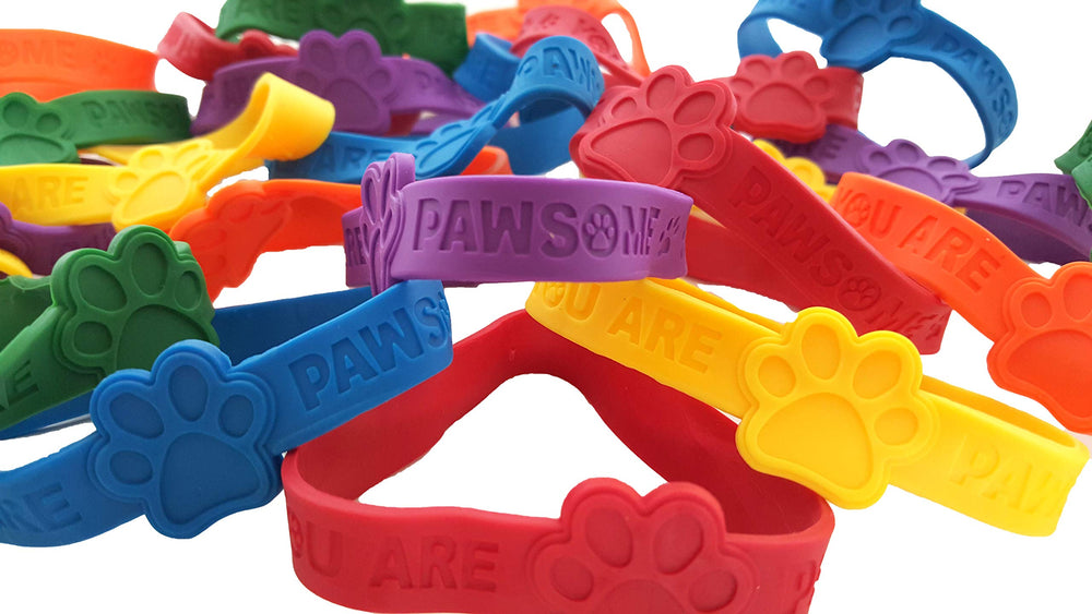 Dondor paw print bracelets closeup showing soft rubber and bright colors for kids.