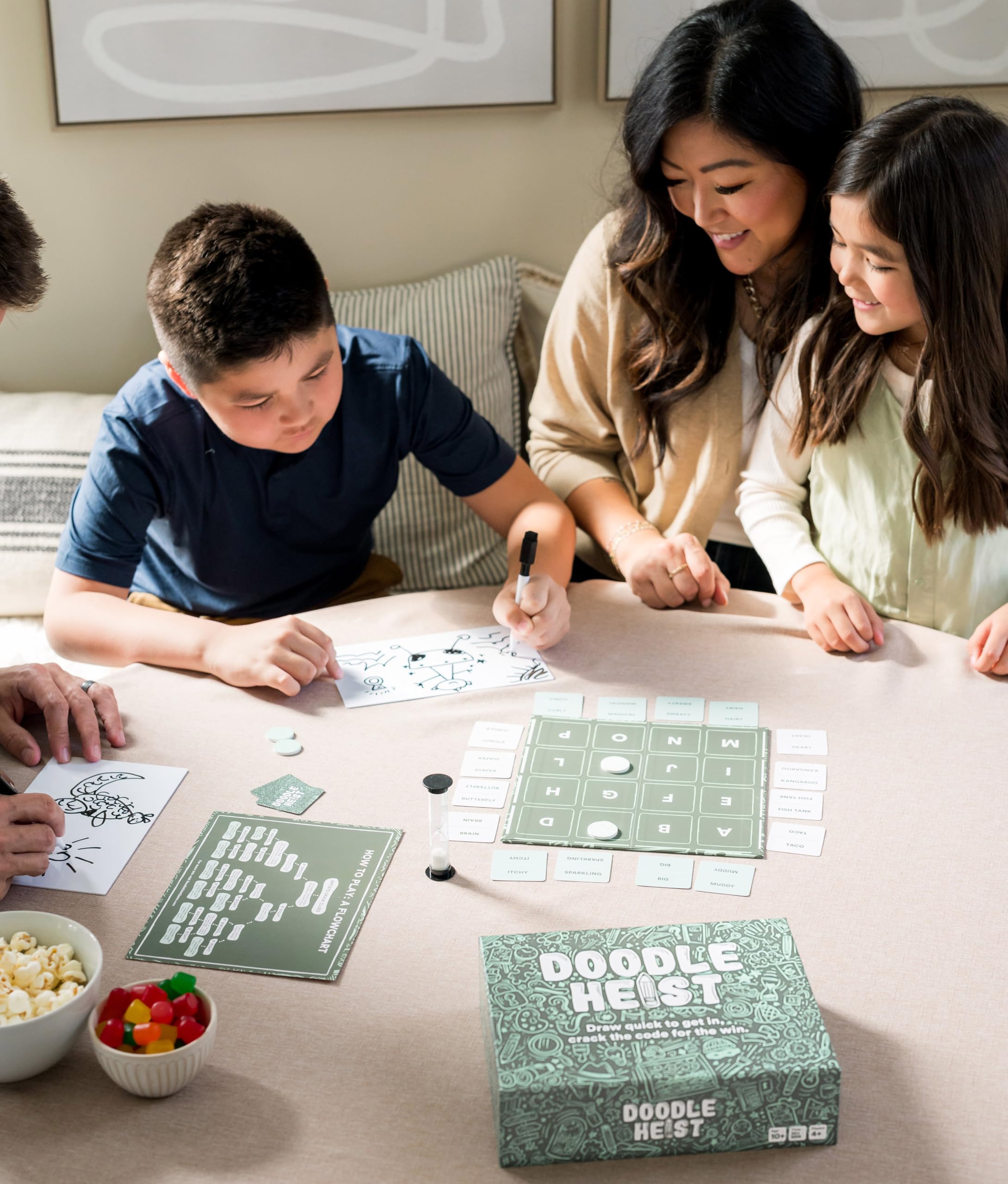 DOODLE HEIST friends laughing during a dynamic game night.