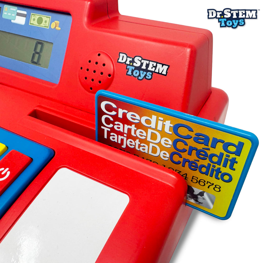 Child playing with the pretend cash register during learning.