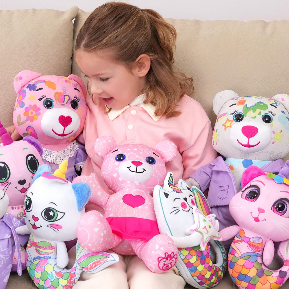 Child coloring the DRAWMYTOY plush toy with washable markers
