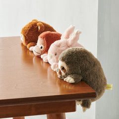 Dreams Posture Pal Sloth dimensions 10.5 by 6.3 by 4 inches on desk.