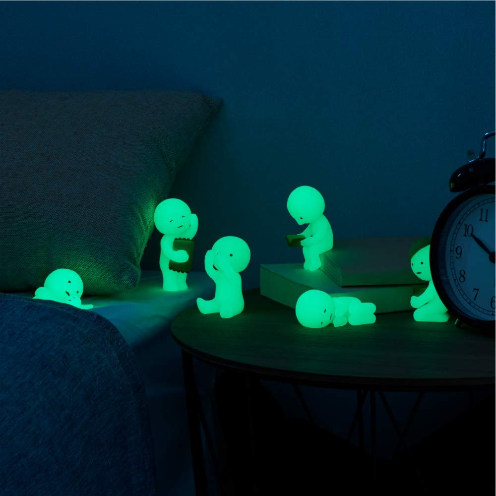 Dreams Smiski glow-in-the-dark bed-relaxing figure creates a cozy nightstand accent