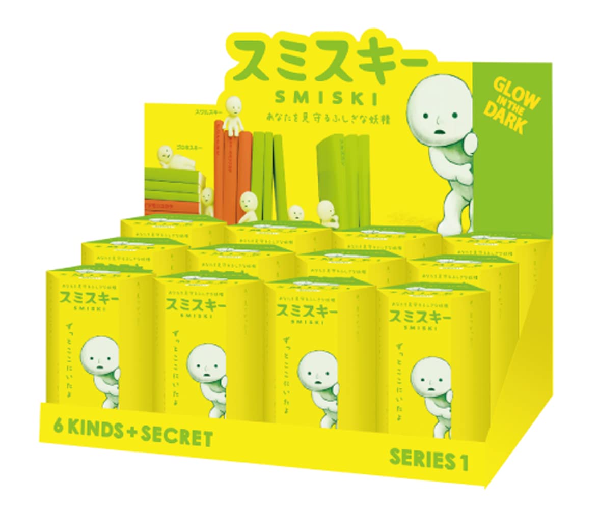 Dreams Smiski glow-in-the-dark figure Series 1 on display, adds subtle ambient light.