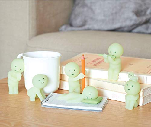 Dreams Smiski twelve-unit case shown for collectors.
