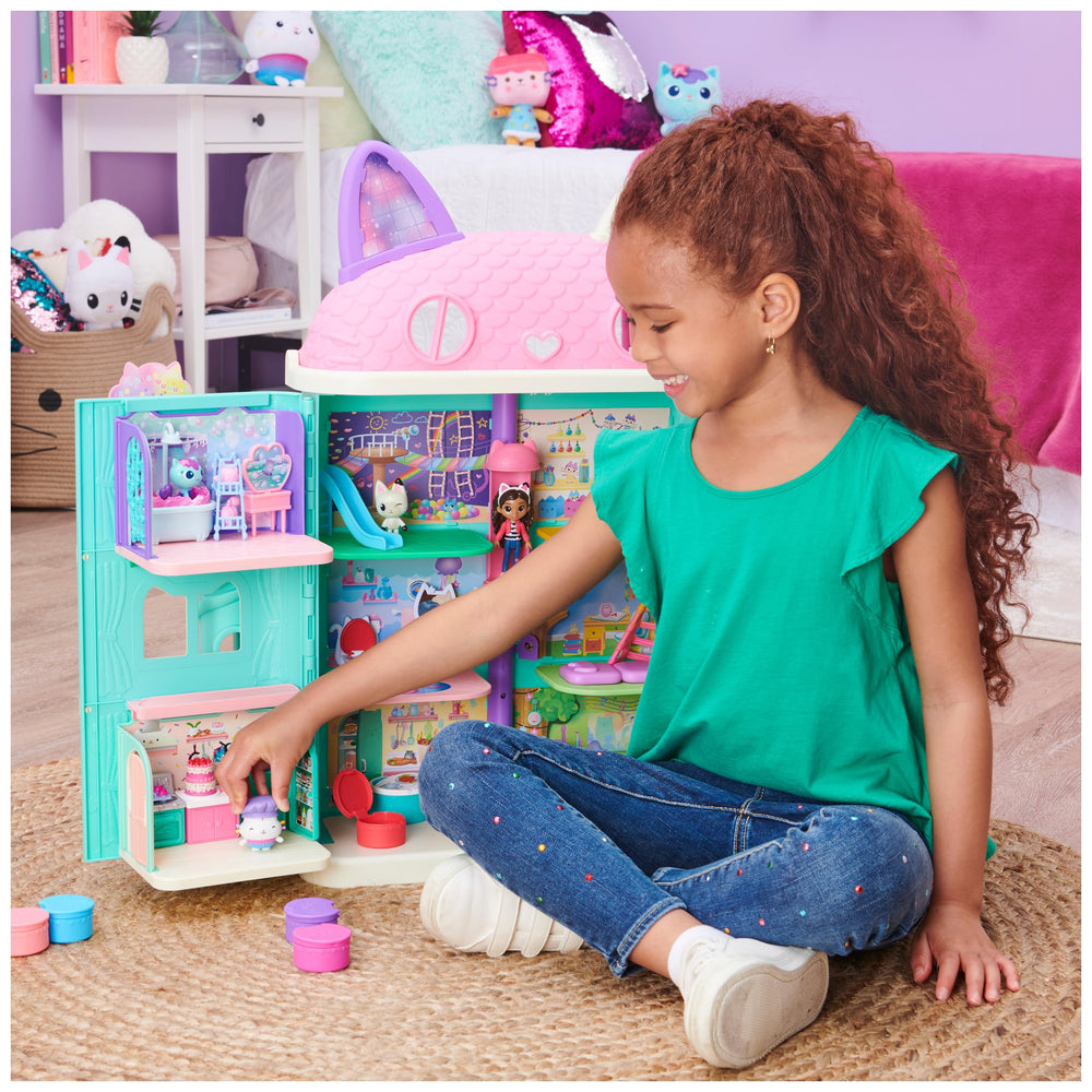 DreamWorks Gabby’s Dollhouse Bakey Kitchen fridge opens to store treats.