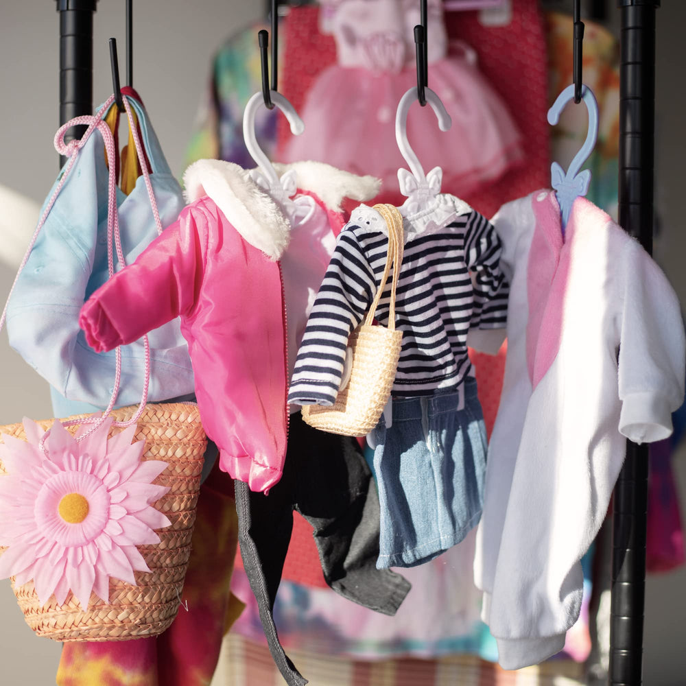 Dress Along Dolly purple hanger for easy outfit building and play