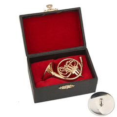 Dselvgvu brass miniature horn showing polished gold-plated finish.