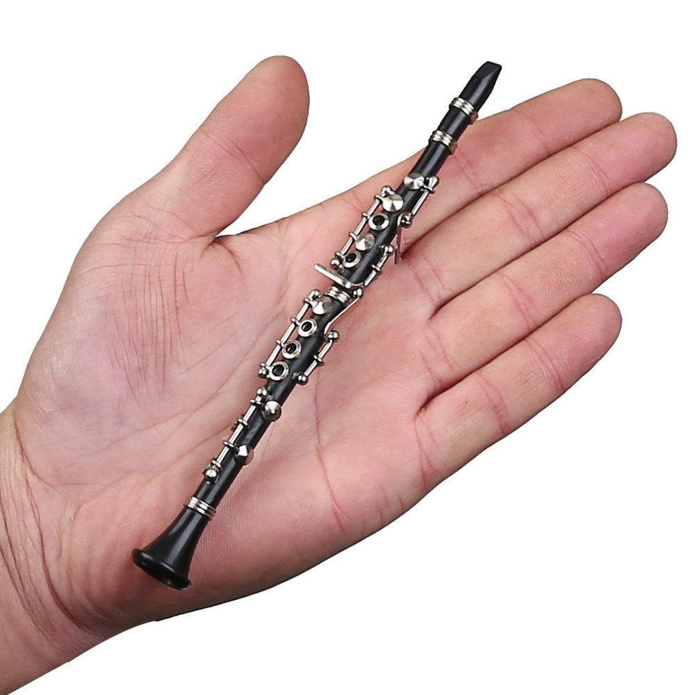 Dselvgvu miniature clarinet case, red velvet-lined and ready for elegant display.