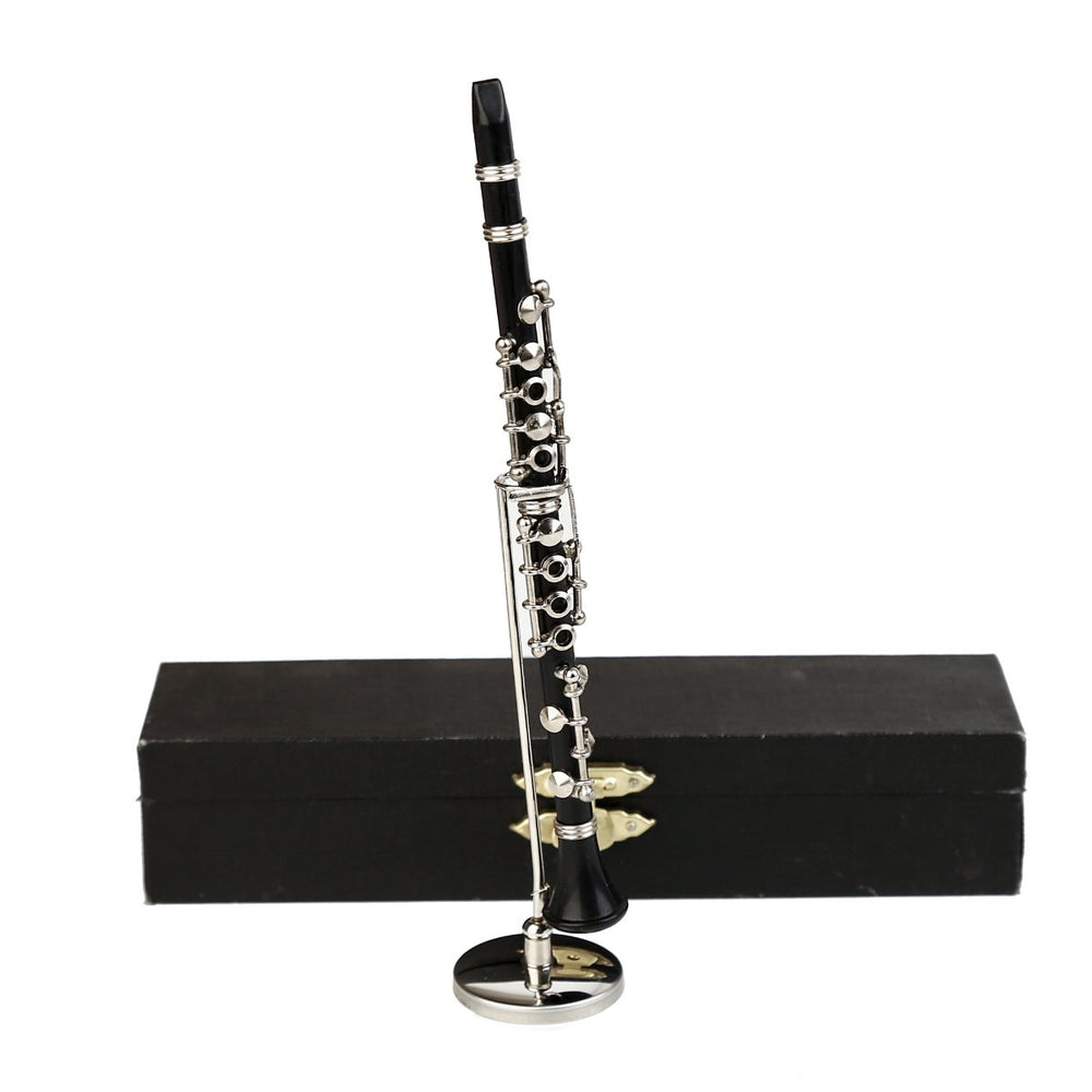 Dselvgvu miniature clarinet stand, a detailed resin-and-metal replica ideal for shelf display.