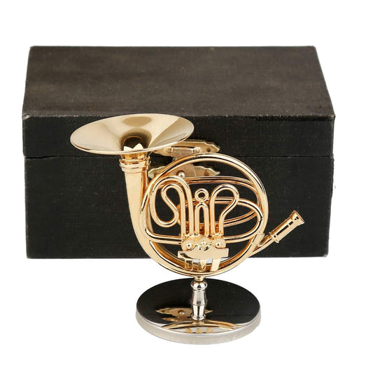 Dselvgvu miniature french horn on a stand for elegant desk display.
