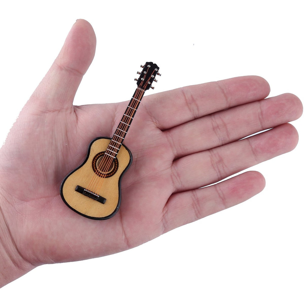 Dselvgvu miniature guitar in red velvet case for protection and display.