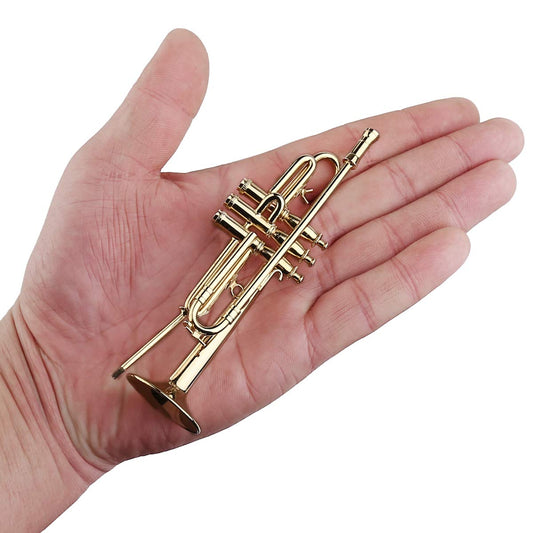 Dselvgvu miniature trumpet in red velvet case protects the collectible.