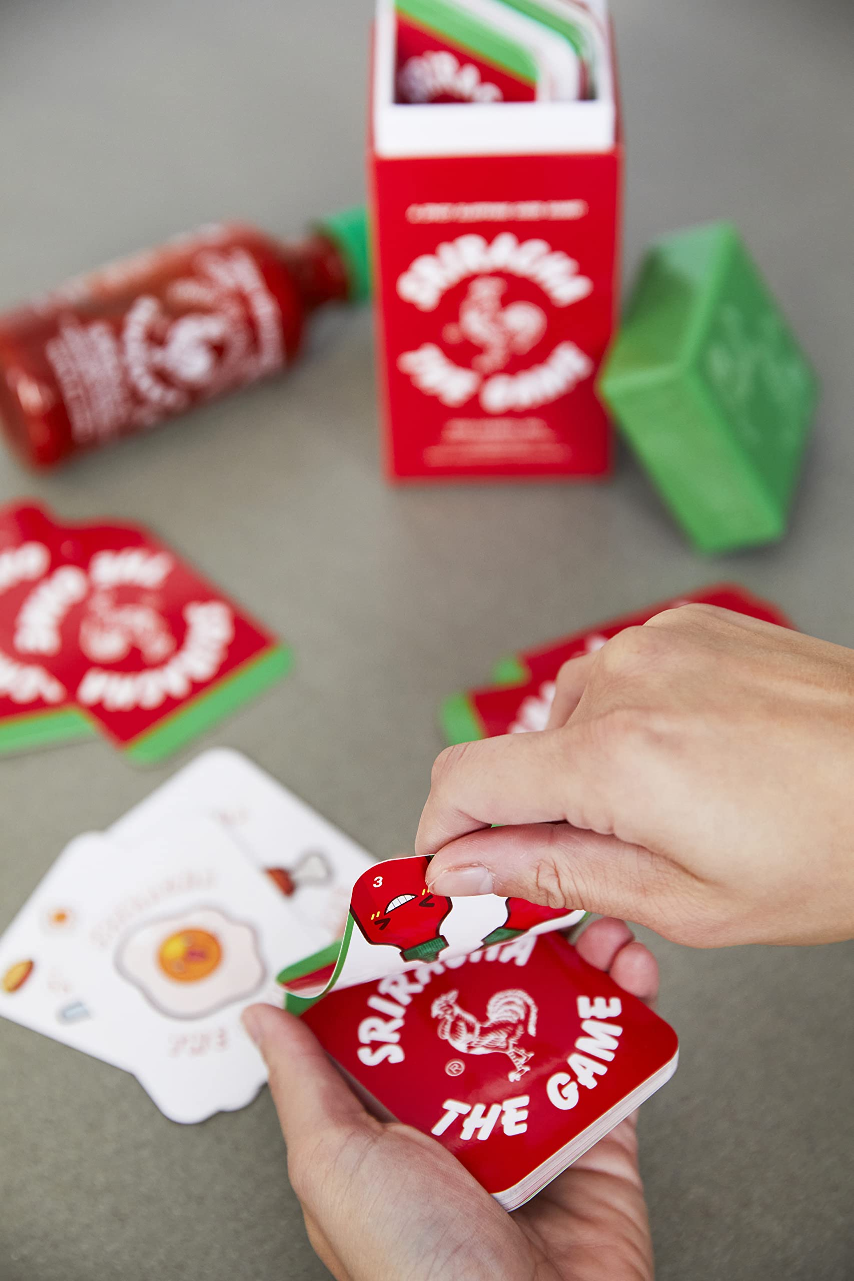 Inside view reveals official license and vibrant Sriracha-themed illustrations.
