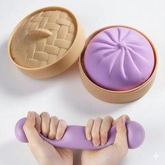 Dumpling Squishy Toy with steamer packaging for authentic stress relief.