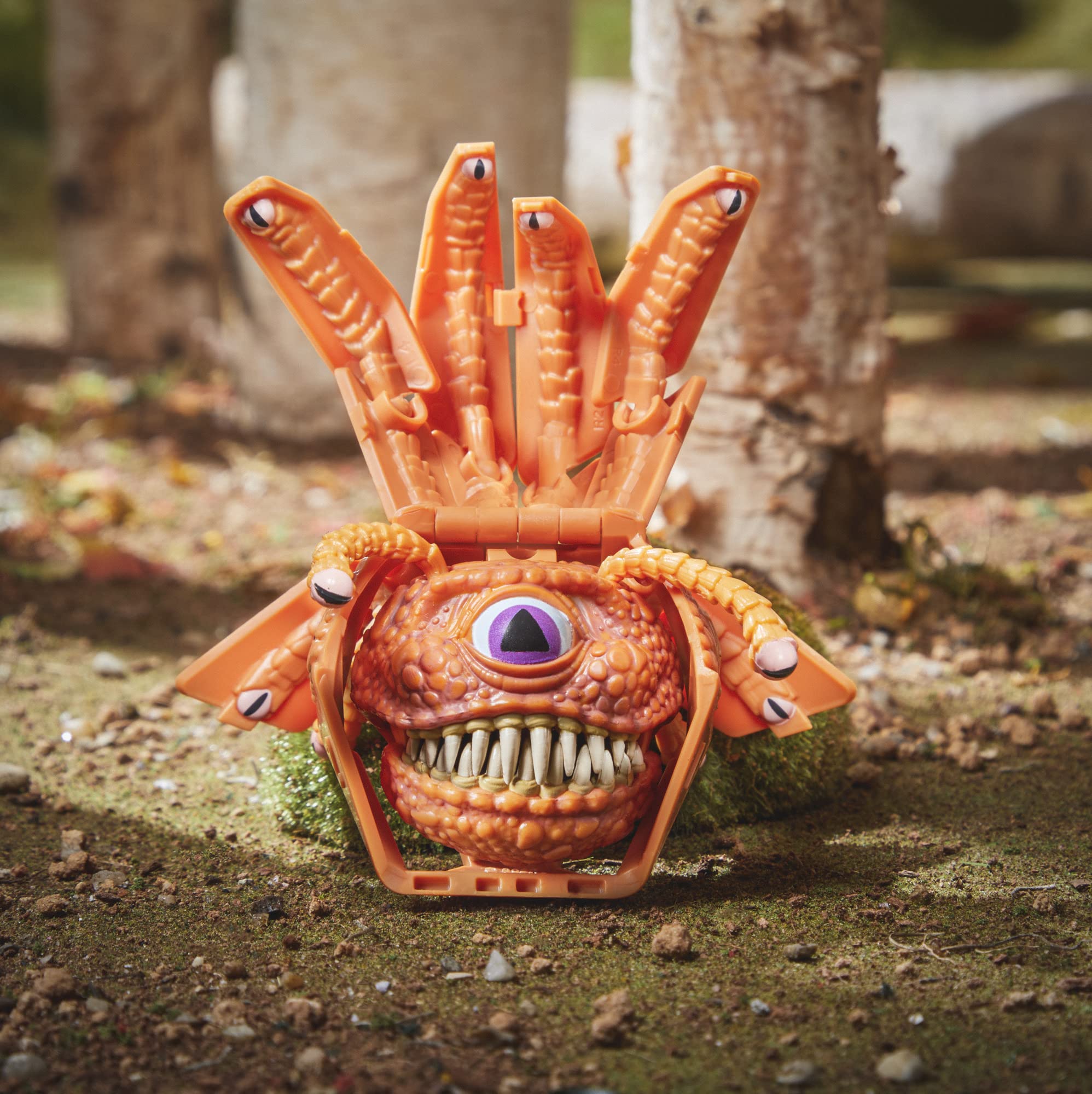 Beholder Dicelings shown in ready-to-display pose on a shelf.