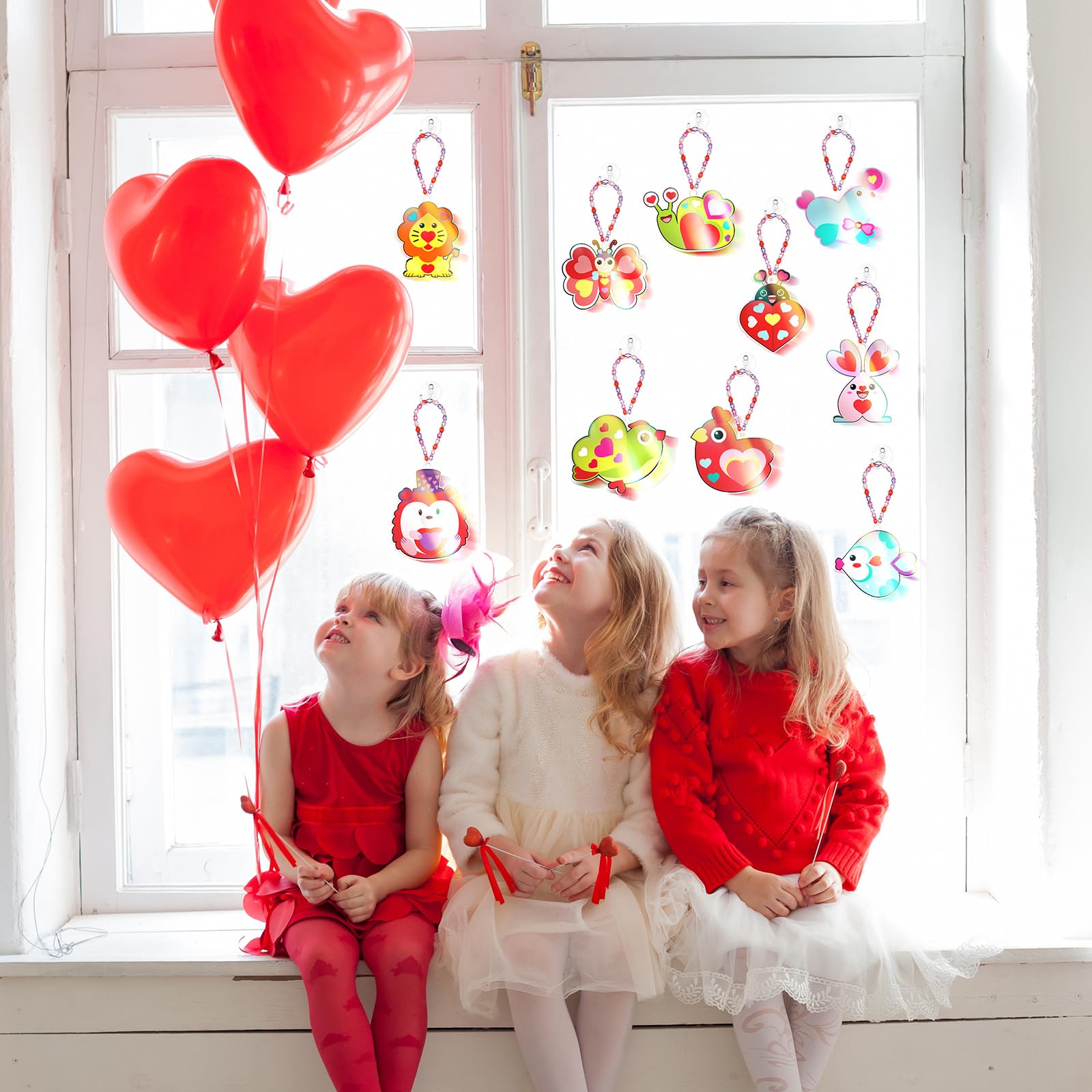 Dunzoom fishing line secures hanging loops for durable window art