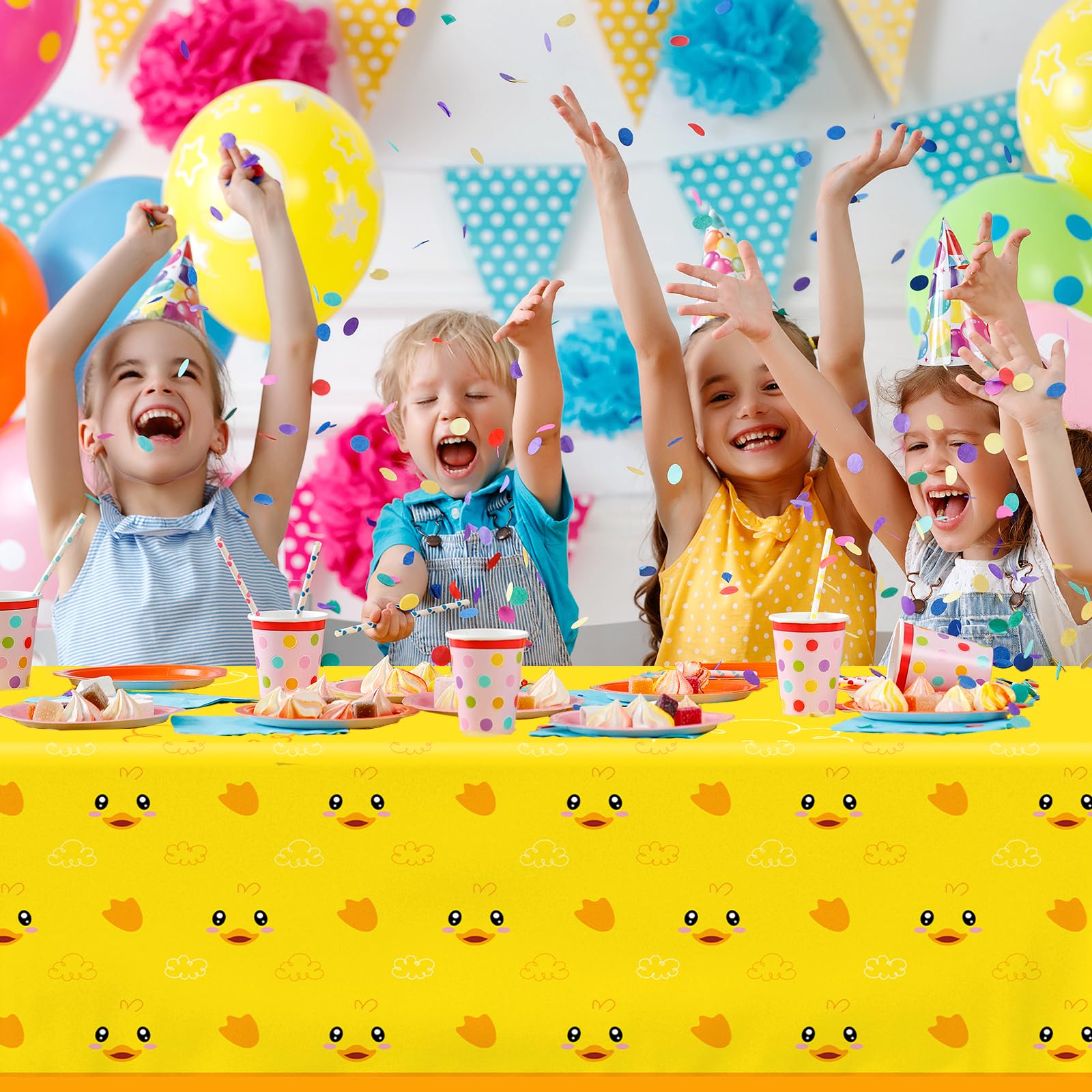 Dydamud yellow duckie tablecloth on an indoor party table.