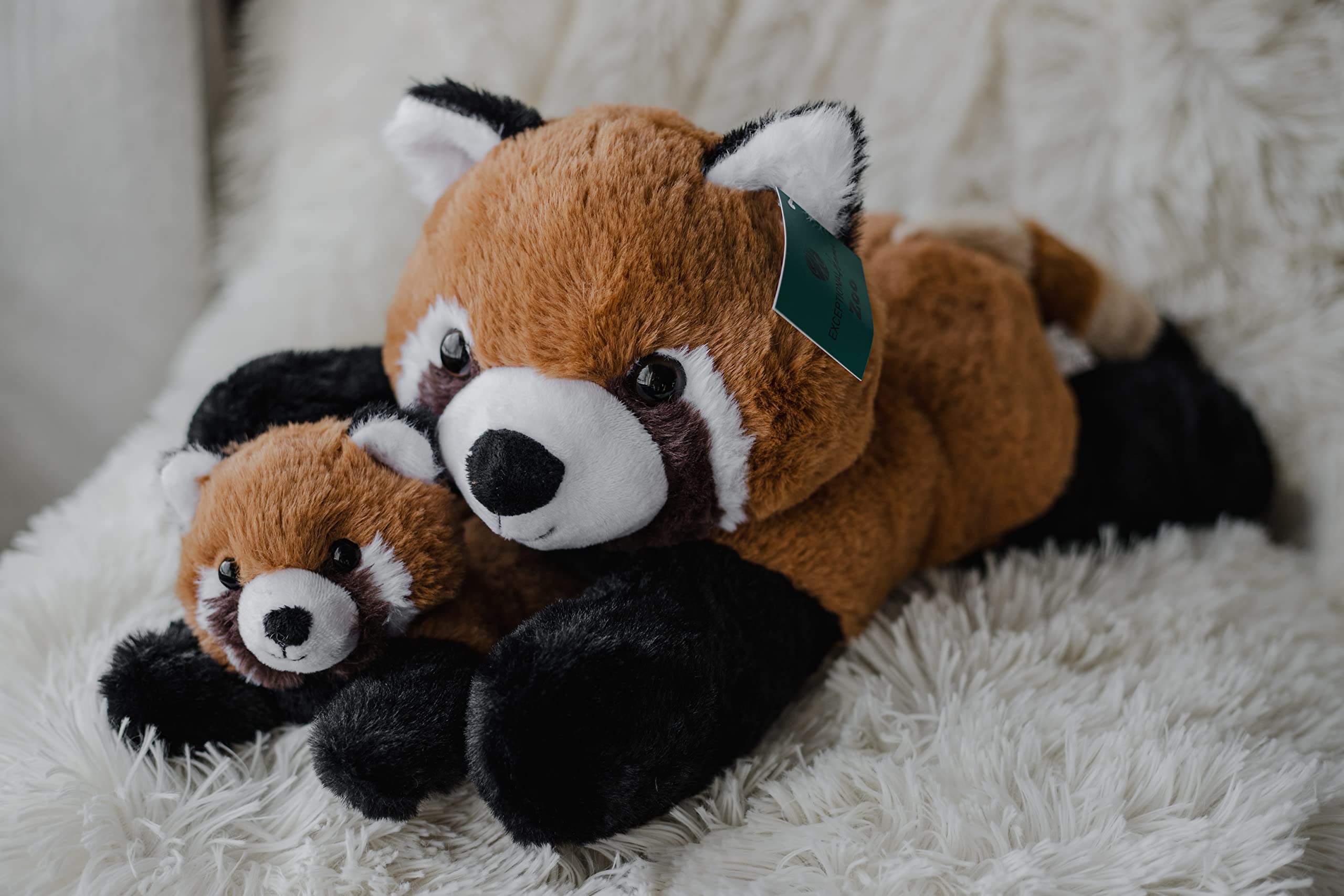 EH Exceptional Home panda plush toy on a shelf for playful decor.