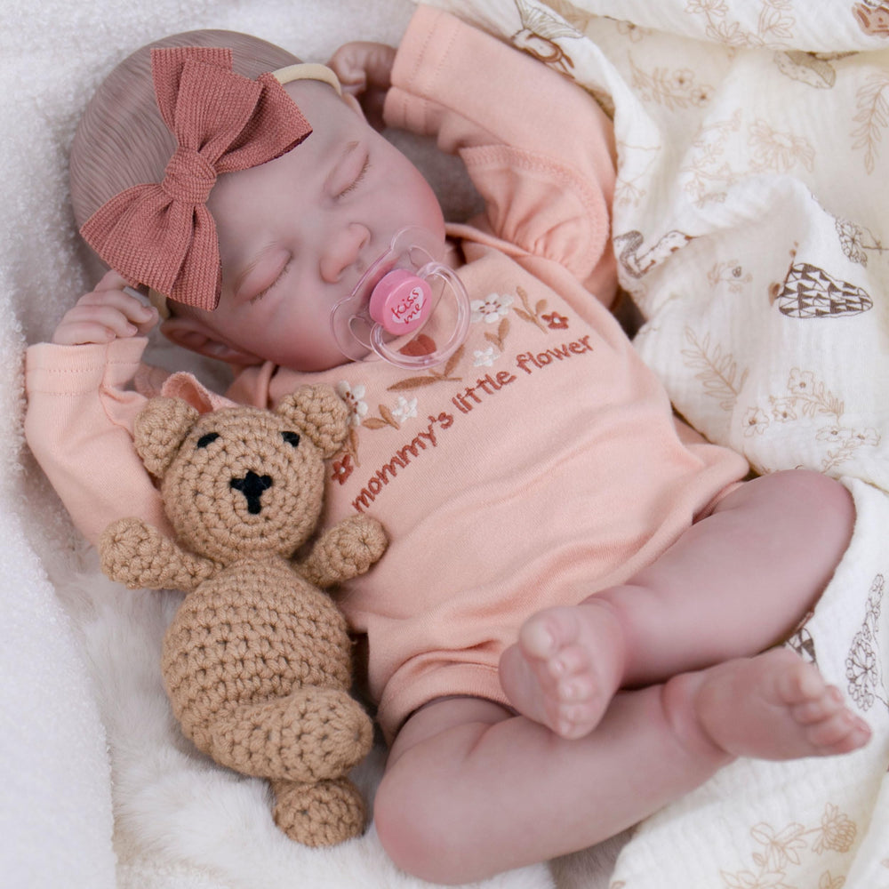 EKOKIZ lifelike 20-inch doll body close-up showing weighted feel for natural posing