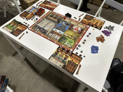 Player mats organize actions for smooth turns during holiday sessions.