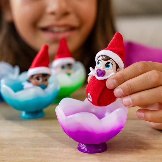 Elf on the Shelf Frost Pips Frost Flower Cradle showcases gentle warmth for baby elves.