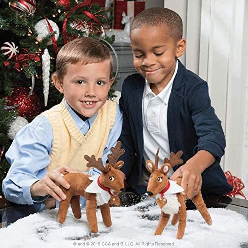 The Elf on the Shelf Pets Reindeer Tradition plush with storybook open.