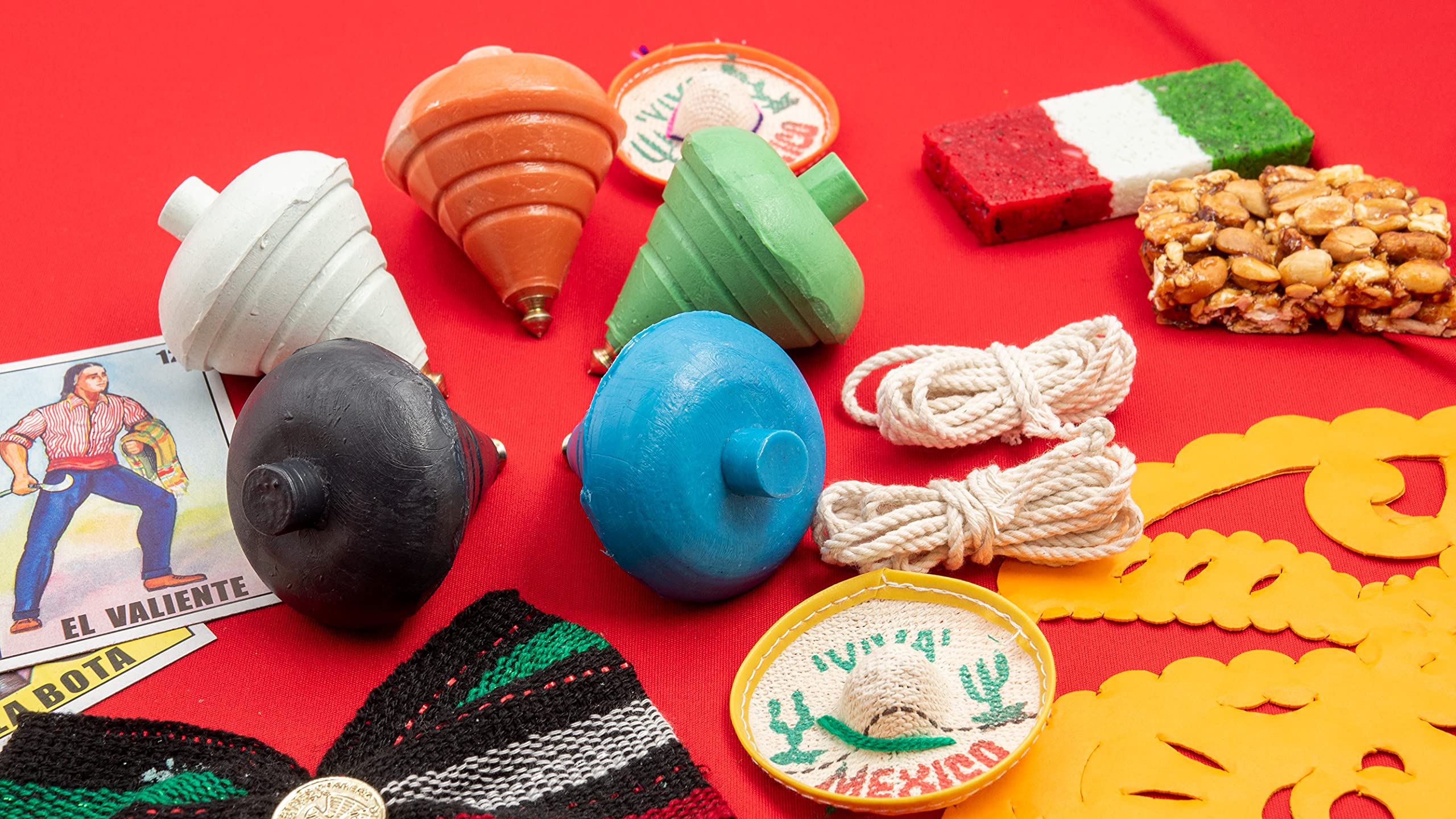 ELIASM Spinning Top five-pack shown outdoors on concrete for active play