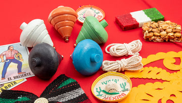 ELIASM Spinning Top five-pack shown outdoors on concrete for active play