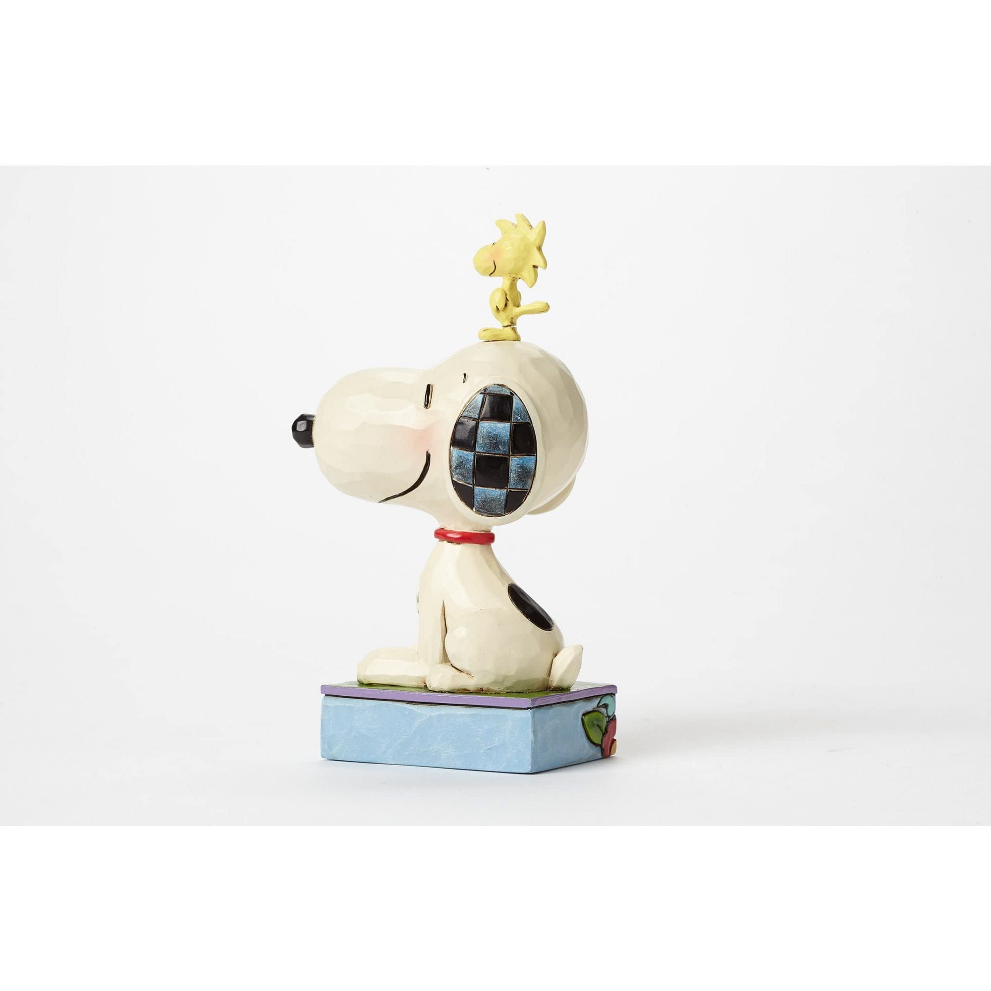 Enesco Jim Shore folk-art quilt-pattern Snoopy and Woodstock figurine brightens any collection