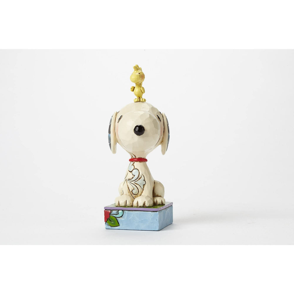Enesco Jim Shore rosemaling accents enhance Snoopy and Woodstock figurine's vintage appeal