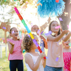 EnriQ pinata stick in action at a festive party.