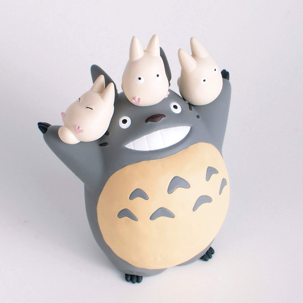 Ensky Totoro flower accessories add decorative flair to shelves.